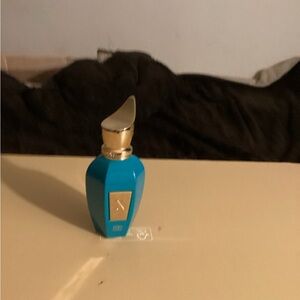 Elegant Blue and Gold Perfume Bottle